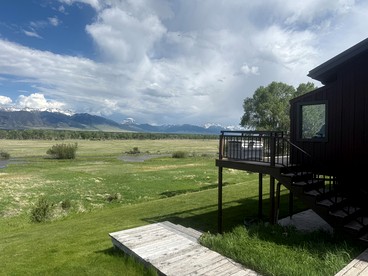 Charming Riverfront Guest House with Deck Overlooking Madison River, Near Ennis, Montana - Ennis, Montana - glamping.directory