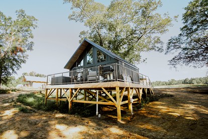 Cozy Modern Cabin with Deck and Hot Tub in Cedar Bluff, Alabama - glamping.directory