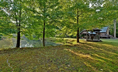 Luxurious Log Cabin Rental with a Fishing Pond in Cherry Log, Georgia - Cherry Log, Georgia - glamping.directory