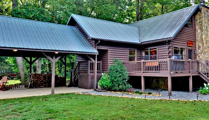 Luxurious Log Cabin Rental with a Fishing Pond in Cherry Log, Georgia - glamping.directory