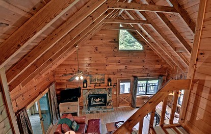 Luxurious Log Cabin Rental with a Fishing Pond in Cherry Log, Georgia - Cherry Log, Georgia - glamping.directory