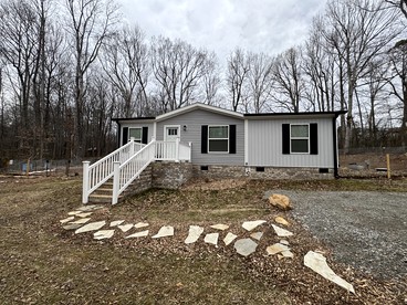 Peaceful Farmstead Cottage with Creekside Views Near Iron Station, North Carolina - glamping.directory