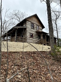 Redesign Wooden Cabin with Jacuzzi and Front Porch in North Carolina - glamping.directory