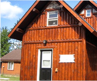 Rustic Lakeside Cabin Rental with a Paddleboat and Canoe in Rhinelander, Wisconsin - glamping.directory