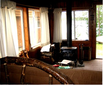 Rustic Lakeside Cabin Rental with a Paddleboat and Canoe in Rhinelander, Wisconsin - Rhinelander, Wisconsin - glamping.directory