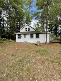 Secluded Lakefront Cottage in Raymond, Maine - glamping.directory