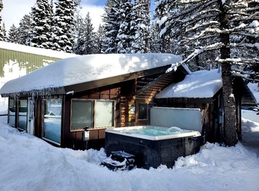 Charming Riverfront Cabin with Hot Tub and Dock Access Near Scenic Trails in Island Park, Idaho - Island Park, Idaho - glamping.directory