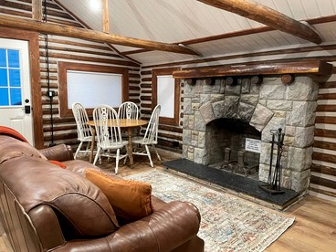 Charming Riverfront Cabin with Hot Tub and Dock Access Near Scenic Trails in Island Park, Idaho - Island Park, Idaho - glamping.directory