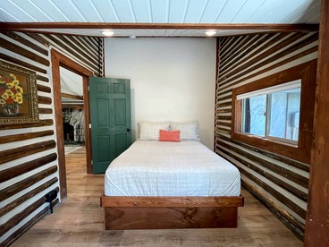 Charming Riverfront Cabin with Hot Tub and Dock Access Near Scenic Trails in Island Park, Idaho - Island Park, Idaho - glamping.directory