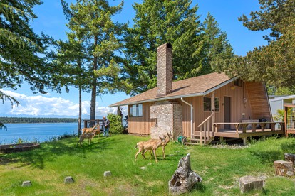 Incredible Sunset at Beachfront Glamping Cabin on Private, Herron Island with Fire Pit and Kayaking near Olympia, Washington - glamping.directory