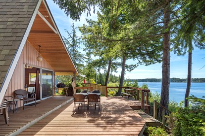 Incredible Sunset at Beachfront Glamping Cabin on Private, Herron Island with Fire Pit and Kayaking near Olympia, Washington - Lakebay, Washington - glamping.directory