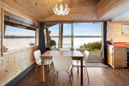 Incredible Sunset at Beachfront Glamping Cabin on Private, Herron Island with Fire Pit and Kayaking near Olympia, Washington - Lakebay, Washington - glamping.directory