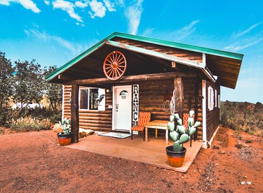 Rustic Cabin Rental with Porch at Foot of Abajo Mountains near Moab, Utah - glamping.directory
