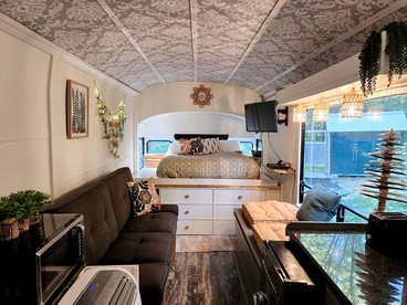Rustic Converted School Bus with Outdoor Shower Near ORV Trails in Manistee National Forest, Michigan - Bitely, Michigan - glamping.directory