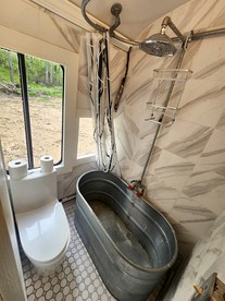 Rustic Converted School Bus with Outdoor Shower Near ORV Trails in Manistee National Forest, Michigan - Bitely, Michigan - glamping.directory
