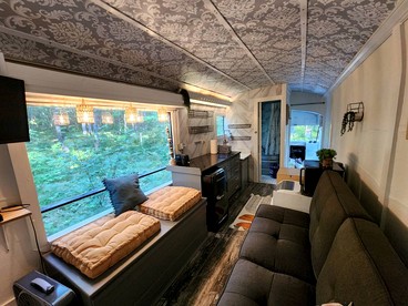 Rustic Converted School Bus with Outdoor Shower Near ORV Trails in Manistee National Forest, Michigan - Bitely, Michigan - glamping.directory