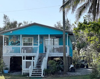 Charming Waterfront Cottage with Private Dock near Little Gasparilla Island, Florida - glamping.directory