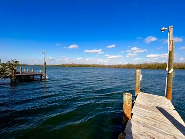 Charming Waterfront Cottage with Private Dock near Little Gasparilla Island, Florida - Placida, Florida - glamping.directory