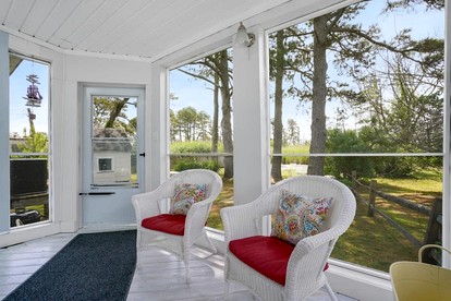 Creekside Cottage with Sunroom and Fire Pit - with Plenty of Outdoor Space Near Assateague Island in Chincoteague, VA - Chincoteague, Virginia - glamping.directory