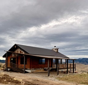 Rustic Mountain Cabin Retreat with Wrap-Around Porch & Scenic Views Near Livingston, Montana - glamping.directory