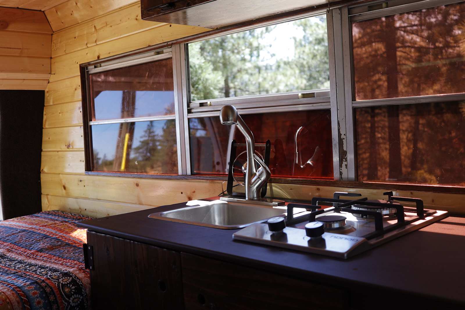 Skoolie in a secluded meadow - Littlerock, California - glamping.directory
