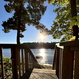 Charming Lakefront Cabin with Hot Tub and Beach Access near Traverse City, Michigan - Traverse City, Michigan - glamping.directory