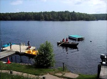 Simple Cabin Rental with Screened-In Porch on Moose Lake near Eau Claire - Hayward, Wisconsin - glamping.directory