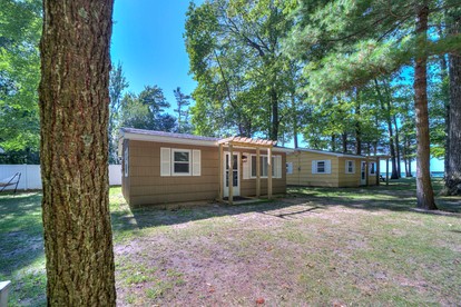 Lakeside Cabin Rental with Beach Access and Fire-Pit for Relaxing Getaways to Lake Michigan - Muskegon, Michigan - glamping.directory