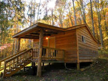 Enchanting Cabin Rental in the Woods with Shared Hot Tub near Arab, Alabama - glamping.directory