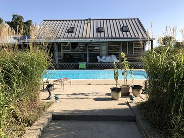 Pet-Friendly Log Cabin with an Outdoor Pool near Crofton, Kentucky - glamping.directory