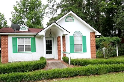 Quaint Cottage with Covered Dock on the Pond and Walking Trails in Georgia - glamping.directory