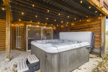 Wooden Spacious Cabin with Jacuzzi, Game Space and Fire Pit in Idaho - Island Park, Idaho - glamping.directory