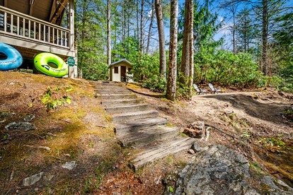 Secluded Riverfront Cabin with Hot Tub, Sauna & Private Trails near Cashiers, North Carolina - Cashiers, North Carolina - glamping.directory