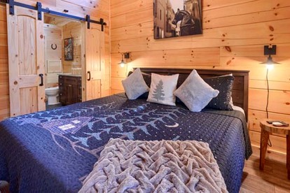 Romantic Getaways to this Rustic Cabin Rental with Stone Fireplace in Logan, Ohio - Logan, Ohio - glamping.directory