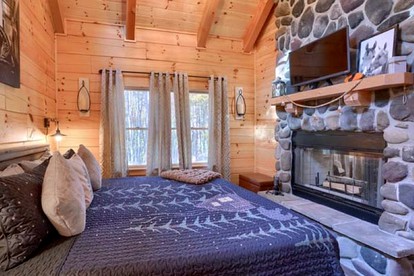 Romantic Getaways to this Rustic Cabin Rental with Stone Fireplace in Logan, Ohio - Logan, Ohio - glamping.directory