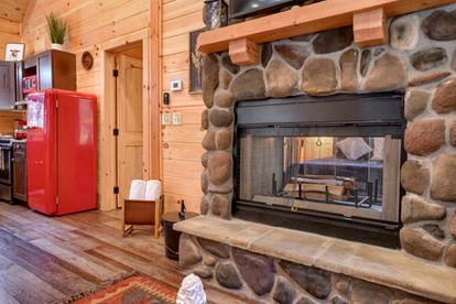 Romantic Getaways to this Rustic Cabin Rental with Stone Fireplace in Logan, Ohio - Logan, Ohio - glamping.directory