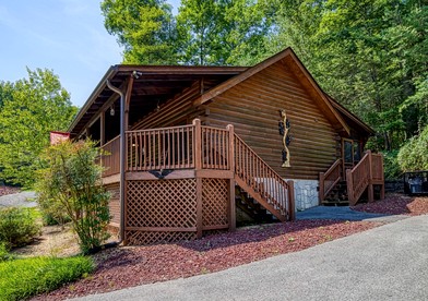 Delightful Rustic Log Cabin with Hot Tub and Community Pool in Pigeon Forge, Tennessee - glamping.directory