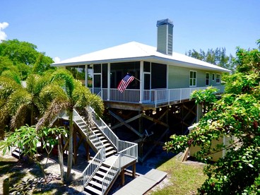 Charming Island Retreat with Gulf Views & Private Dock Access near Little Gasparilla, Florida - glamping.directory